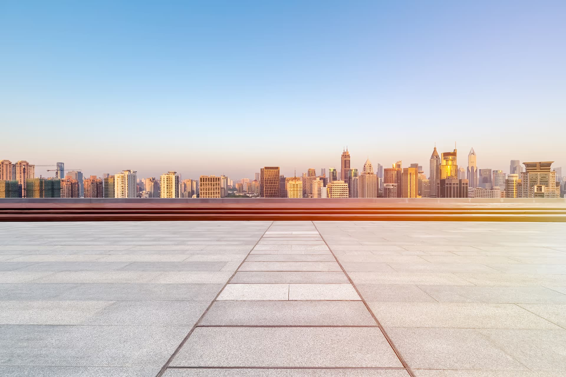 Flat commercial roof system over a city skyline